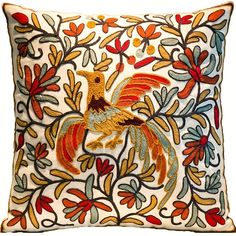 an embroidered pillow with roosters and flowers on white background, in the shape of a flower