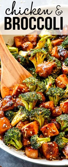 chicken and broccoli stir fry in a pan with a wooden spoon