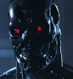 a robot with glowing red eyes in a dark room