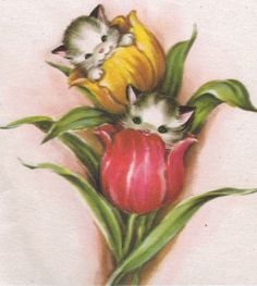 two kittens are sitting on top of a flower