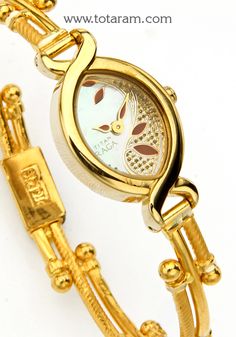 22 karat gold watch - titan raga watch - womens gold watch
  diameter of the watch dial : 0.75 inches
  please note: the dial of the watch is not made of gold, only the strap connecting (joining) the watch is made of gold


introducing our 22 karat gold watch - titan raga watch, a stunning piece of jewelry that combines style and elegance. this exquisite women's gold watch is the perfect accessory to add a touch of glamour to any outfit. 
  
  featuring a sleek design, this watch Womens Gold Watch, Watch Womens, Gold Watches Women, Gold Watches, Watch Dial, Bangles Style, Gold Jewelry Indian, 22k Gold, Gold Watch