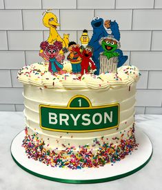 the cake is decorated with sesame street characters