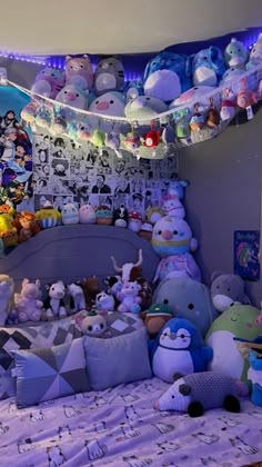 a room filled with lots of stuffed animals on top of it's walls and ceiling