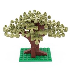 a lego tree is shown with lots of holes in the trunk and leaves on it