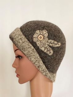 "This felted wool hat is the hat with an attitude   A unique and captivating hat resembling those hats of days gone by, this hat is approximately 22\" in circumference and can also be stretched if necessary.  This style of hat can be worn in many different ways, totally up to you - there is no wrong way or right way - just the way you choose to wear it! A felted flower and leaf, which are sewn on, accentuate and add dimension to the brown hat.  The hat is trimmed in a brown/white tweed. This hat Felted Hat, Handmade Hats, Disposable Razor, Brown Hat, Brown Hats, White Tweed, Unique Accessories, Womens Winter, Handmade Hat