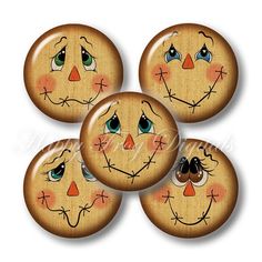 four wooden buttons with faces painted on them