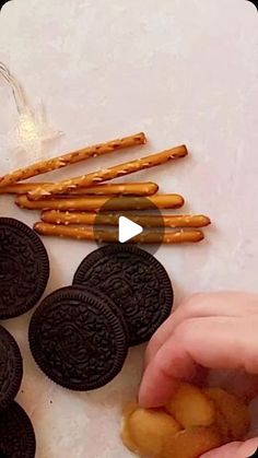 an image of someone making cookies and pretzels with oreos on the side