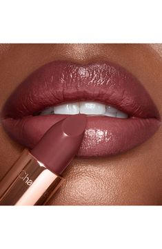 What it is: A twist on Charlotte's best-selling Pillow Talk lipstick, now in a deep intense berry rose shade.What it does: This beloved shade is dialed up to a deeper hue for every one and every mood. It's presented in the super moisturizing K.I.S.S.I.N.G. formula and looks extra dreamy on tan and deep skin tones for a sumptuous, satin-finish pout. How to use: Start by applying your lip liner. Beginning on the outer corners, trace the liner just outside the natural lip line. Apply the lipstick e Charlotte Tilbury Pillow Talk Intense, Pillow Talk Lipstick, Charlotte Tilbury Pillow Talk, Luxury Lipstick, Lip Line, Rose Lipstick, Deep Skin, Natural Lip, Long Lasting Lipstick