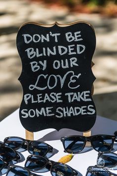 a sign that says don't be blinded by our love please take some shades