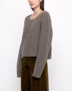 A chunky supersoft and ultra-warm yak-alpaca-extrafine merino wool knit. Features a relaxed and boxy fit, with a cropped silhouette. This sweater perfectly balances out all your high-waisted trousers. + Details Color: Umber 31% Yak, 31% Alpaca, 22% Recycled Nylon, 16% RWS Extrafine Merino Wool XS, S, M, L Julie is 5’9” and wearing a L + Care Hand wash cold, lay flat to dry. Do not tumble dry. Can be dry cleaned. Please note, fine and soft wools can be susceptible to slight pilling. If pilling oc Chunky Cropped Sweater, Sweater Shaver, Trousers Details, Knitwear Dress, Wool Knit, Soft Yarn, High Waisted Trousers, Cropped Sweater, Lay Flat