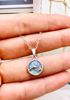 "This beautiful ocean wave necklace is perfect for any occasion!  Love that feeling of peace that the Ocean always seems to bring? Imagine taking the beach with you everywhere you go! This beautiful handmade resin necklace makes the perfect jewelry choice for a beach vacation, a gift for a best friend, or just a reminder of the sea.  Necklace is handmade with resin, and your choice of either silver plated or sterling silver necklace chain.  Chain Length: 18 or 20 inches long  CHOICES OF CHAIN MA Ocean Jewelry Necklaces, Ocean Gift Ideas, Ocean-inspired Adjustable Charm Necklace Gift, Ocean-inspired Strand Charm Necklaces As Gift, Blue Beachy Jewelry For Gift, Personalized Turquoise Jewelry For Beach, Personalized Adjustable Beach Necklaces, Adjustable Ocean-inspired Necklace, Personalized Adjustable Necklace For Beach