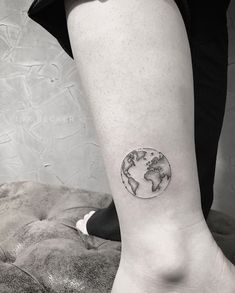 a person with a small tattoo on their leg