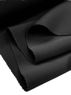 black fabric folded on top of each other