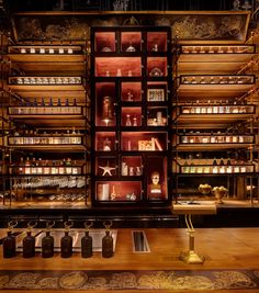 the shelves are full of bottles and other items on display in an antique style store