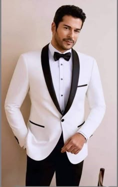 Are you planning a wedding or other social event that you want to look good and stand out in the crowd? Then this suit is a must have.  It is carefully made and finished with the best of fabric.  It comes in white color but can be customized in any color of your choice.  Product Details: 1. White 2 piece single breasted suit (jacket/coat & pants). 2. Sewed with a blend of cotton and wool fabric of high quality.  3. Comes in sizes XS to 3XL. For larger sizes, kindly contact us. 4. It is a custom White Fitted Blazer With Shawl Collar, Fitted White Blazer With Shawl Collar, White Fitted Shawl Collar Blazer, Classic Long Sleeve Tuxedo For Wedding, Classic Long Sleeve Wedding Tuxedo, Designer White Formal Suits, Fitted White Outerwear For Ceremony, Designer White Evening Blazer, White Fitted Ceremony Outerwear