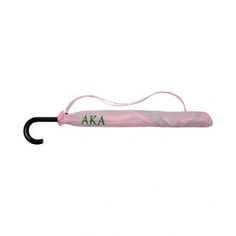 a pink umbrella with the letters aka on it's handle hanging from a hook