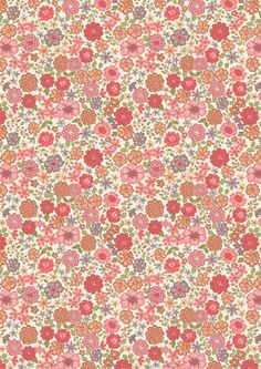 an orange and pink flower pattern on white fabric