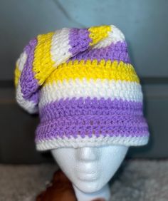 a knitted hat on top of a mannequin head