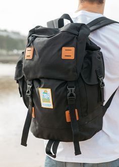 If you're going a little further afield or you just don't like packing too light then this is the rucksack for you! Large Explorer Rucksack in Black finished with our New Wave logo patch. Traveller size fully functional bag perfect for any occasion. This is Carrie's go-to for festival's abroad! You can pack enough for a full week away with plenty of outfit changes (tried & tested!) AND it's the perfect size for cabin luggage so makes for a quicker journey (no waiting for the carousel after a lon Casual Outdoor Backpack With Luggage Sleeve, Nylon Backpack With Pockets For Trip, Outdoor Backpack With Pockets, Black Waterproof Travel Bag For Trip, Large Capacity Backpack For Trip, Black Hiking Bags With Functional Pockets, Black Travel Backpack With Pockets, Black Travel Accessories With Functional Pockets For Outdoor, Black Travel Accessories With Large Capacity