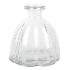 a clear glass bottle with a curved top