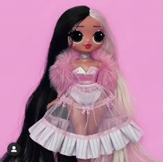 a doll with long black hair wearing a pink dress and fur collar, standing in front of a pink background