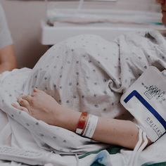 a person in a hospital bed with an iv