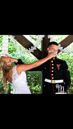 a bride and groom standing under a gazebo