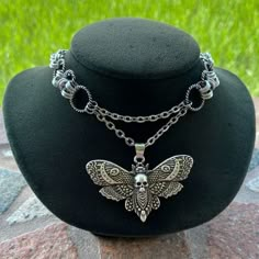 Handmade Maille Choker Necklace With Skull Moon Moth Charm . Necklace Is 13 Inch Adjustable To 15.75 Inch ( Choker Size But If You Need A Different Size Lmk It Is Handmade So I Can Make A Different Size If You Need ) Fine Pewter Moth Charm . Necklace Chains Are Stainless Steel Execpt For The Maille Hoops On Each Sides Those Are Aluminium Material . Aluminium Is Just Like Stainless Steel It Is Nickel Free , Allergy Free , Hypoallergenic , No Itching , Do Not Change Color , Rust Or Turn Skin Green . Tags : Butterfly , Skulls , Wire Wrap , Lunula , Moon Phase , Horns , Crecent Moon , Moon Child , Up Side Down Moon Design / Witch / Fairy / Mermaid / Ocean / Pearls / Blue Green Black Abalone Halloween Inspired Jewelry, Vintage Gothic Jewelry, Grunge Jewelry Necklaces, Moth Accessories, Goth Fairy Aesthetic, Butterfly Skulls, Grunge Necklaces, Whimsigoth Jewelry, Moth Jewelry