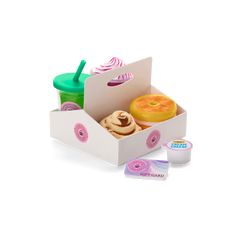 an open box with donuts and cupcakes in it on a white background