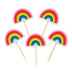 four rainbow lollipop picks on a white background