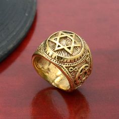 Product:-Ring Material:- Brass Size:- All size available Gold Star  Ring.Jewish Star Ring. Star Ring Jewellery. Archangels Signet Ring .Sacred Symbols Talisman Protective Amulet Shield of David  ❥ Customers' satisfaction is our biggest priority, please contact us with any questions/queries for future or existing orders, and we will do our best to make sure you are happy with your order. ❥Please make sure to add the correct address during checkout. You can return your purchased item within 15 days after successful delivery. We offer a 100% "Money Back Guarantee" if you are not satisfied with your purchase. ❥If you are not satisfied with your purchased items then contact with us first before leaving negative or neutral feedback or opening disputes. We believe in solving the issues. Protective Amulet, Jewish Star, Sacred Symbols, Star Ring, Gold Star, Gold Stars, Signet Ring, Rings Statement, Statement Rings