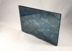 a black and white marbled glass frame on a white background with clippings