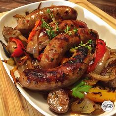 sausages and vegetables on a white plate