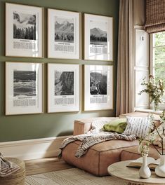 a living room with green walls and pictures on the wall above the couch, along with a coffee table