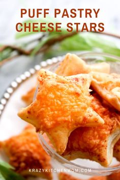 puff pastry cheese stars in a small glass dish on a green cloth with text overlay