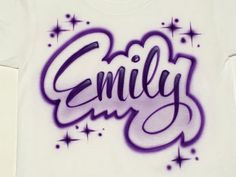 a t - shirt with the word smiley written in purple spray paint on it's chest