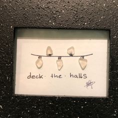 there is a sign on the wall that says deck the hall's with toothpicks