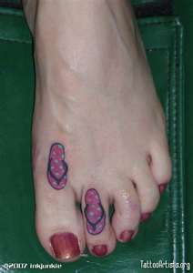 a woman's foot with pink and purple designs on it