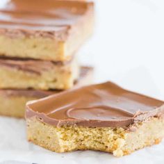 three pieces of cake with chocolate frosting on top