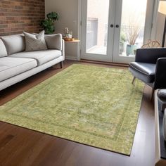 a living room filled with furniture and a green rug