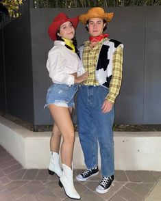 two people dressed in costumes standing next to each other