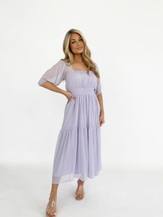 Indulge in the sheer balloon quarter sleeves, tiered flowy ruching, and soft, textured smocked fabric of the Soiree Sweetness Dress. The square neckline, bright pop of color, and elevated, back cutout detail make this midi fit perfect for spring and summer occasions like dinner, drinks, vacation, and wedding guest appearances. Self 100% Polyester Hand wash cold. Flowy Purple Dress, Dinner Drinks, Bright Pop, Purple Dress, Xl Dress, Quarter Sleeve, Square Neckline, Dresses Xs, Wedding Guest