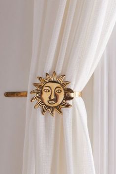 a curtain with a sun motif on it