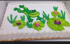 a cake decorated with green and purple flowers