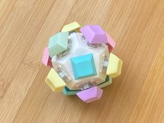 a colorful object sitting on top of a wooden table