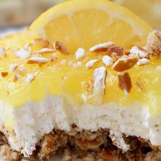 a piece of cake with lemon and nuts on top