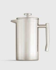 a stainless steel coffee pot with a handle on a white background and the lid is open