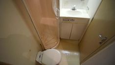 a small bathroom with a toilet and sink