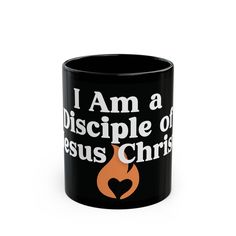 a black coffee mug with the words i am a disciple of jesus christ