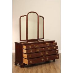 an antique dresser with mirror and wooden drawers